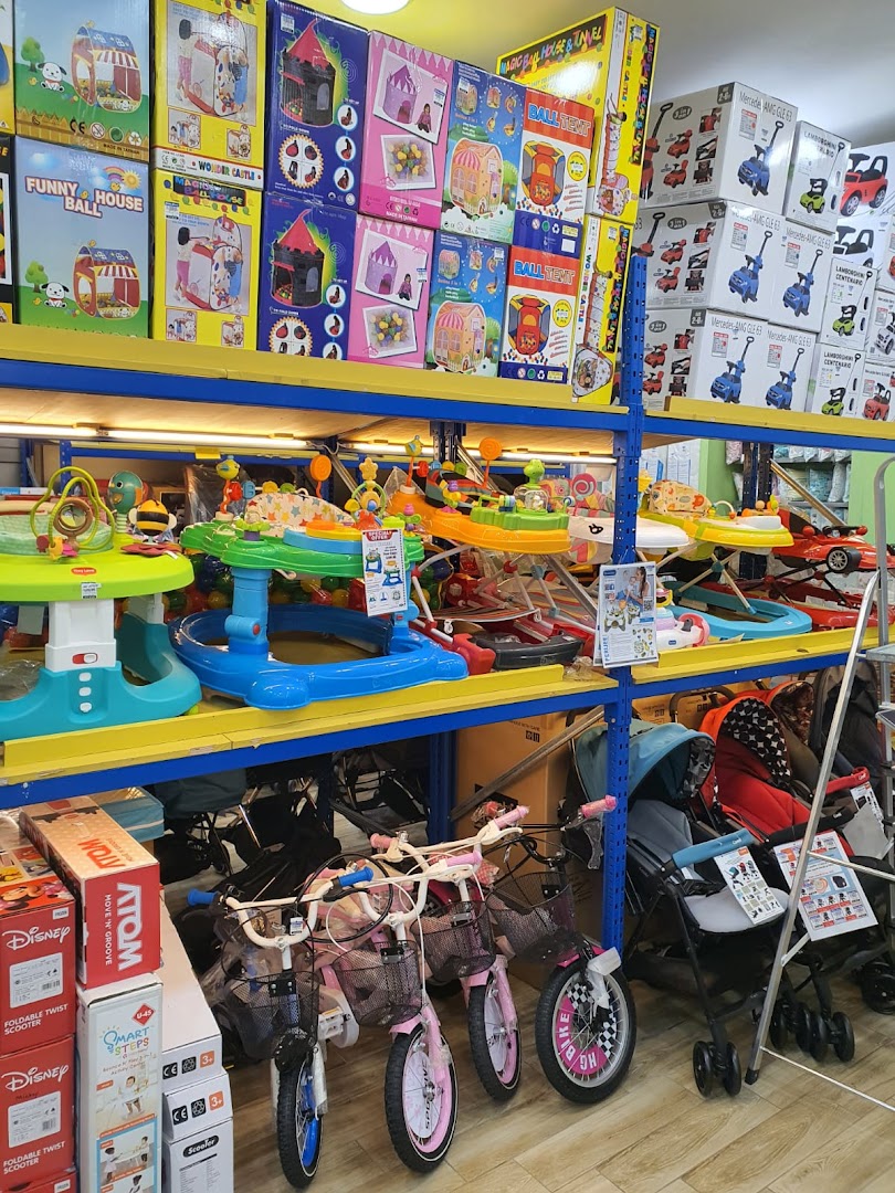 Shelves filled with children's playhouses, walkers, strollers, and bicycles at Kiddy Palace.