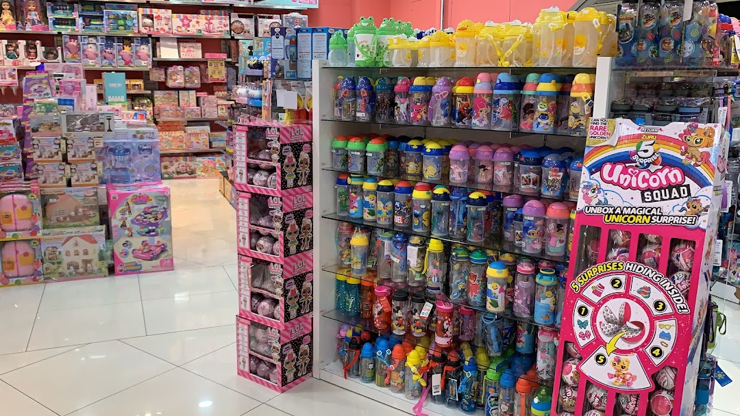 An aisle in Kiddy Palace showcasing a wide variety of toys, water bottles, and children's accessories.
