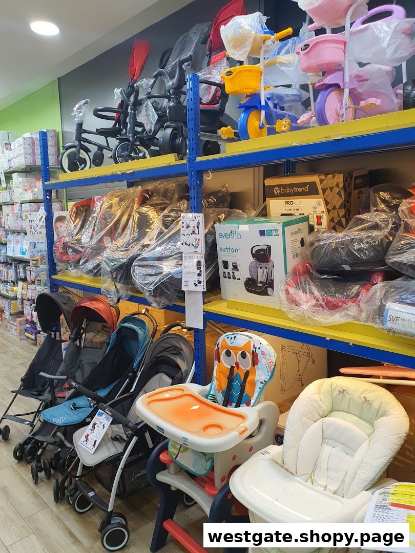 An interior view of Kiddy Palace showcasing baby strollers, high chairs, tricycles, and other infant products.