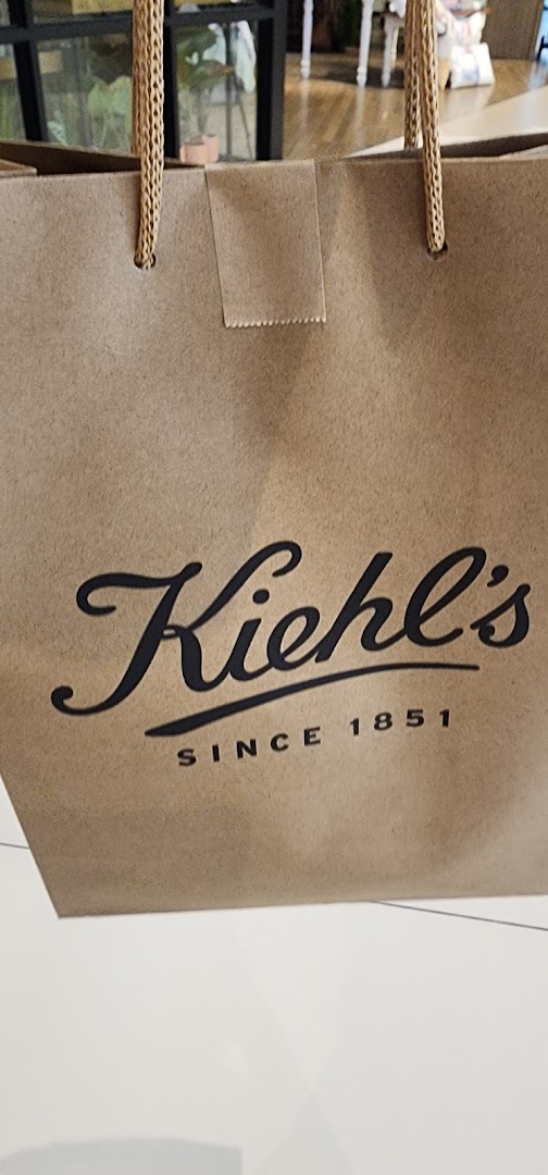 A brown Kiehl's shopping bag featuring the brand's classic logo and 'Since 1851'.