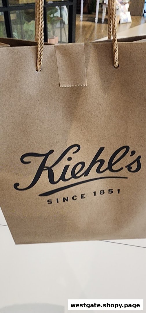 A brown Kiehl's shopping bag featuring the brand's classic logo and 'Since 1851'.