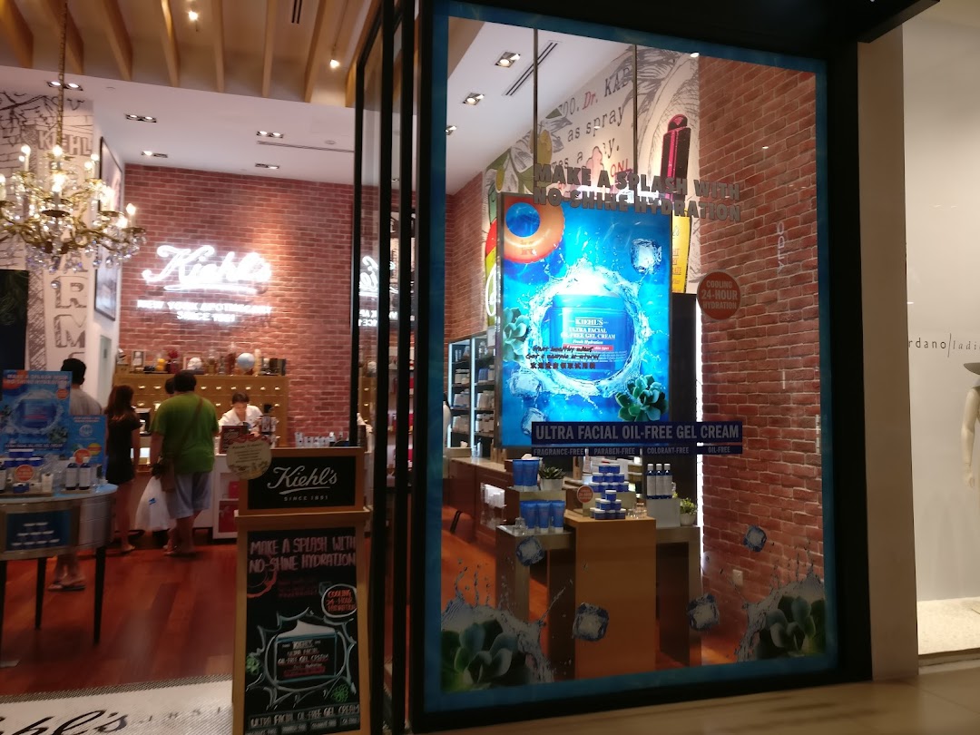 Kiehl's Westgate shop entrance with a vibrant window display featuring skincare products and a welcoming interior.