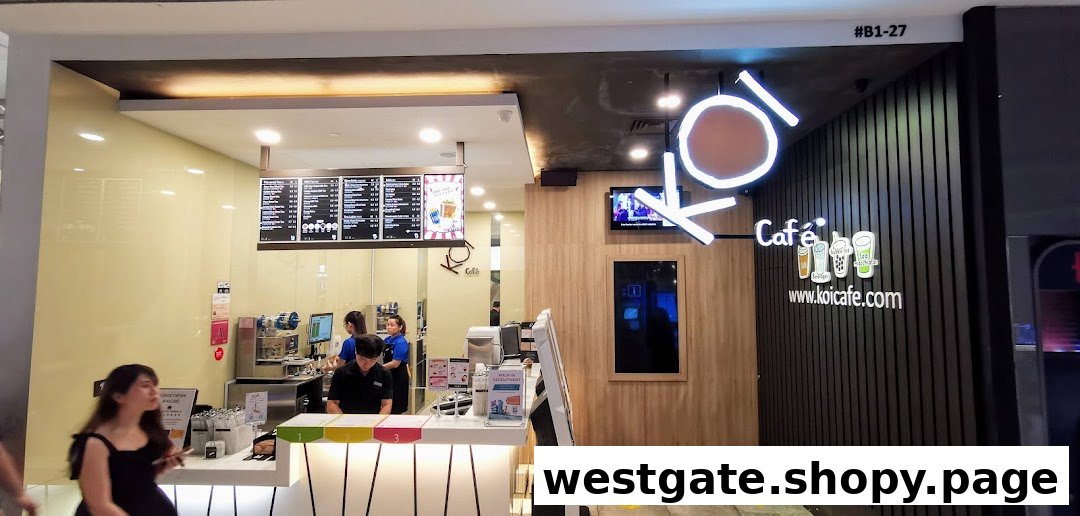 The vibrant storefront of KOI Thé at Westgate Mall, featuring its counter, staff, and prominent signage.