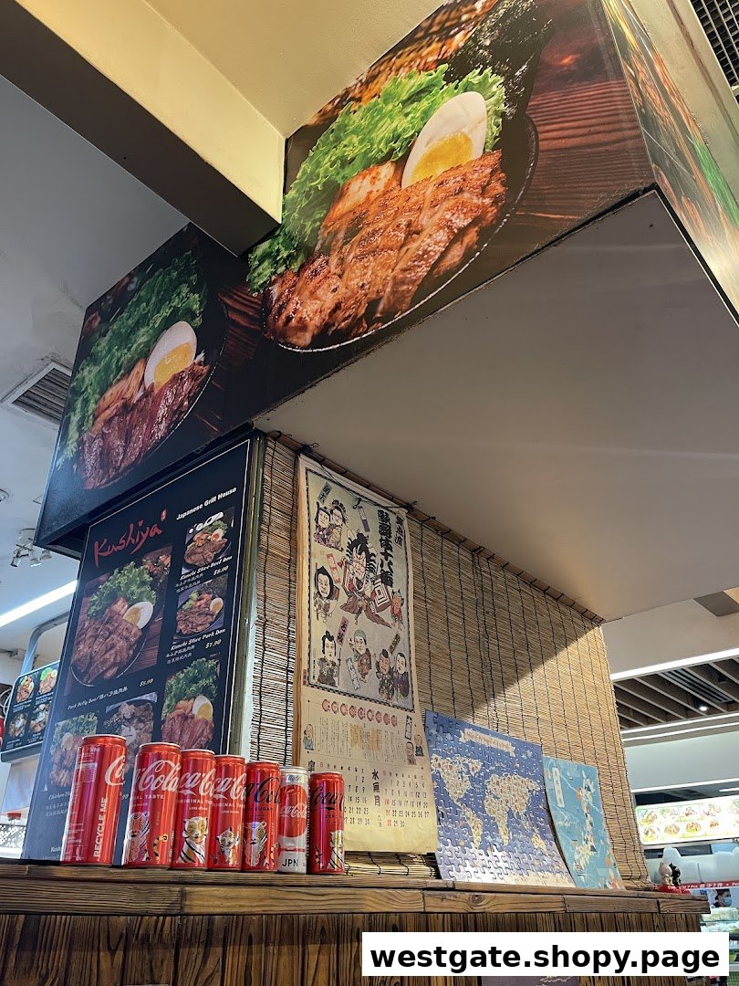 A close-up of Kushiya Japanese Grill House's counter featuring food displays, a menu board, and decorative items.