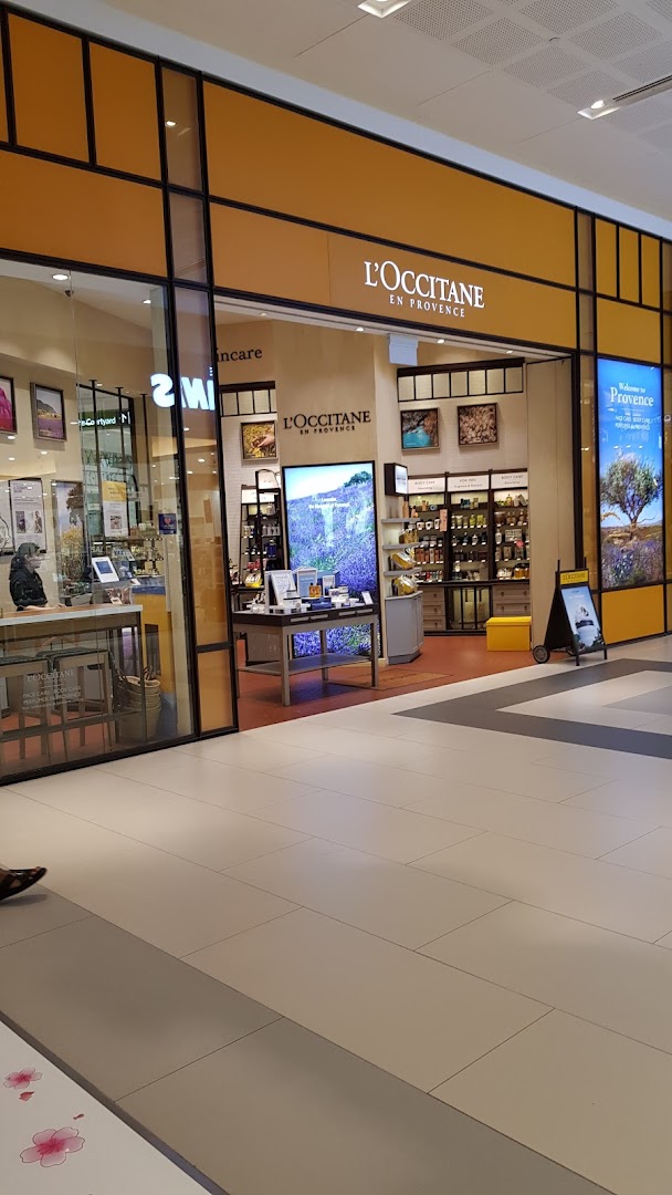 The L'OCCITANE shop front, showcasing its inviting entrance and signature branding within a mall.