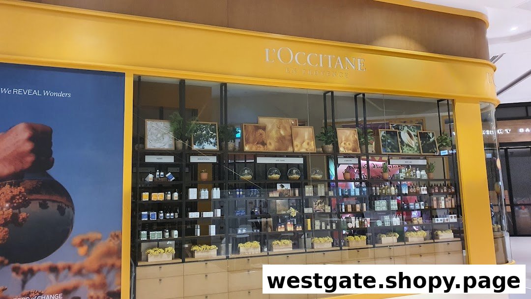 The L'OCCITANE shop front with its distinctive yellow facade and product displays.