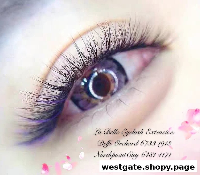 Close-up of an eye showcasing beautifully extended eyelashes, promoting La Belle's services.