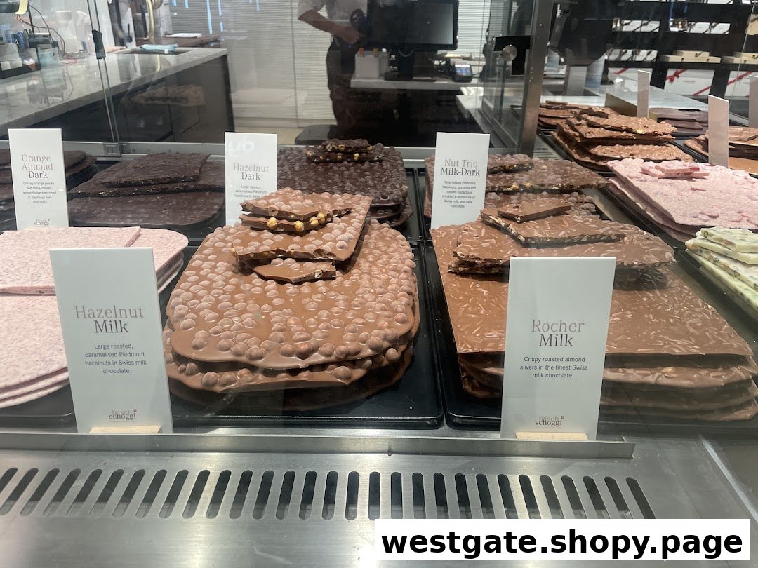 A display case filled with various large chocolate slabs, including hazelnut, almond, and milk chocolate varieties.