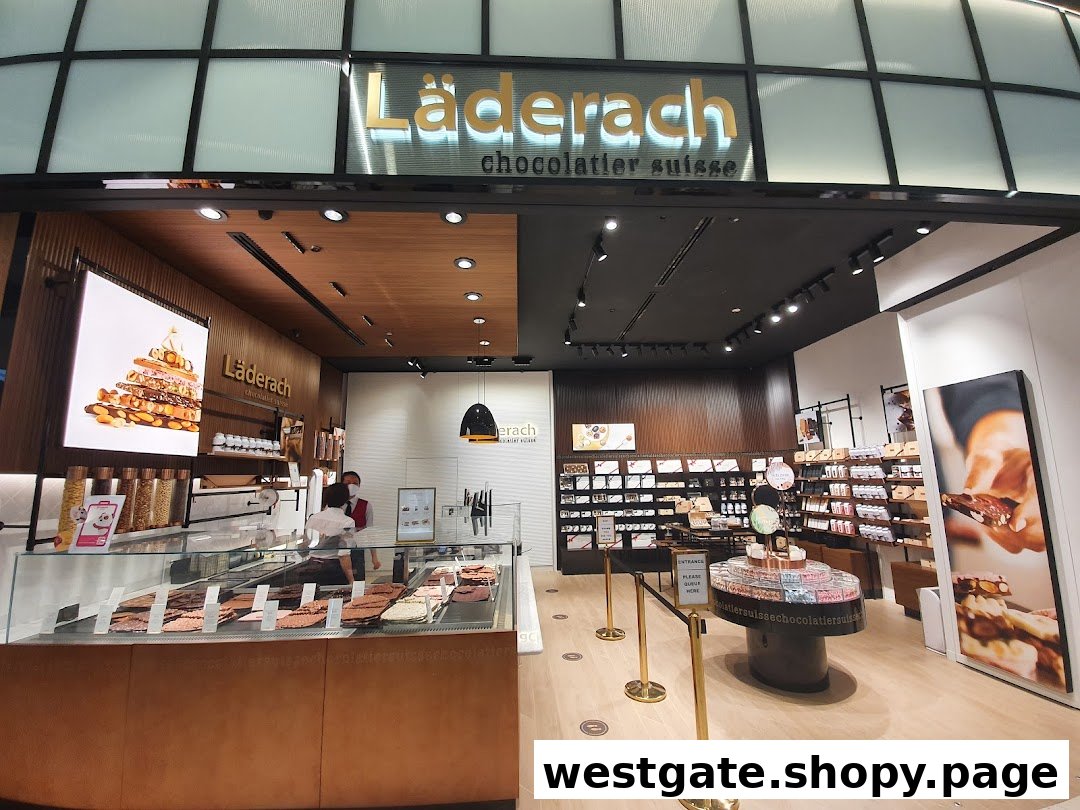 Interior view of Läderach chocolate shop showcasing fresh chocolate displays and retail products.