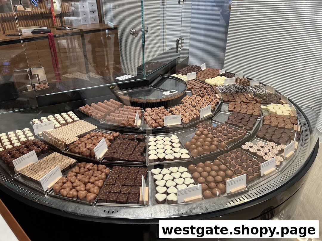A vibrant display case showcasing a wide variety of fresh Läderach chocolates and pralines.
