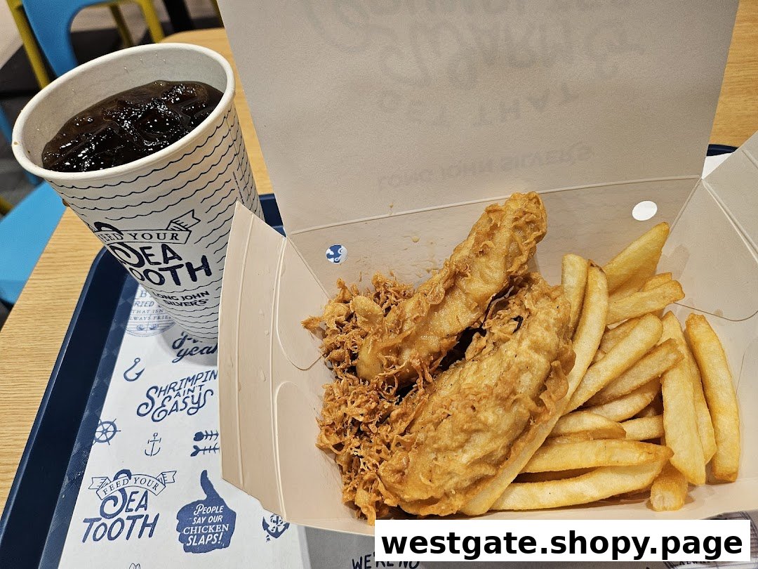 A close-up of Long John Silver's classic fish and chips meal with a drink on a tray.