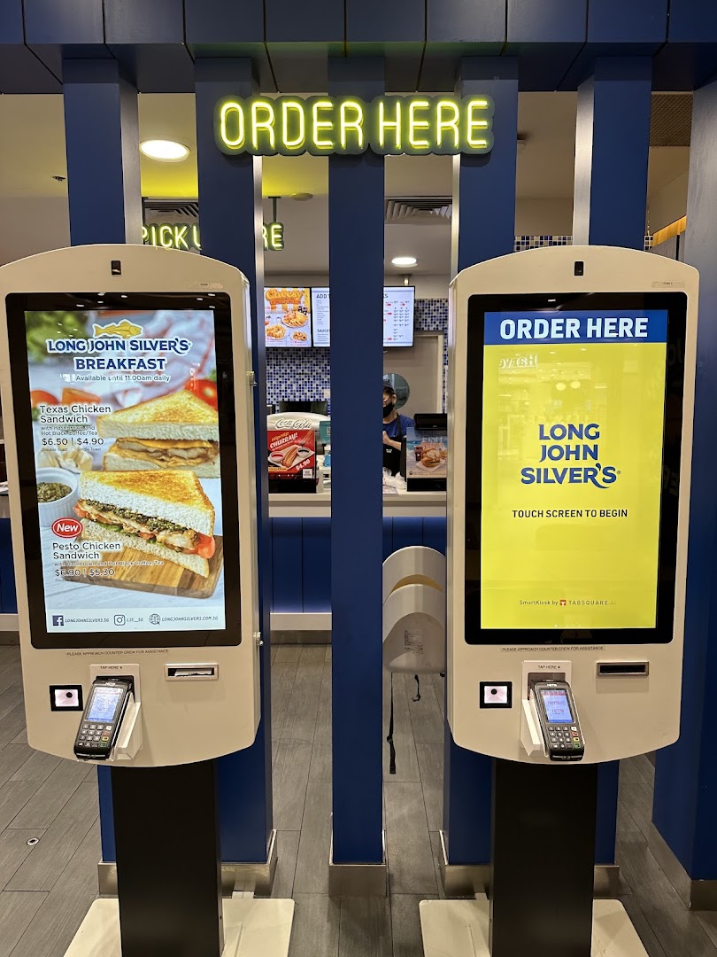 Two self-order kiosks at Long John Silver's, one displaying breakfast menu items.