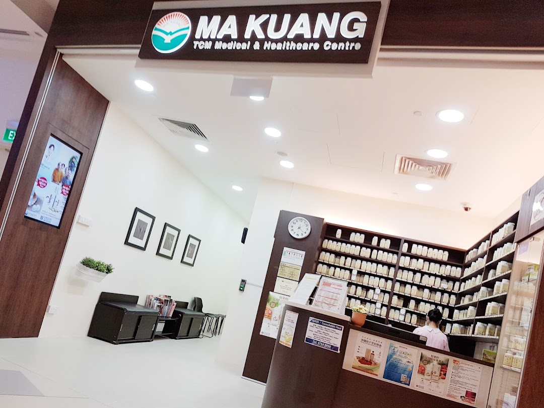 The entrance and interior of Ma Kuang TCM Clinic, featuring a reception desk and waiting area.