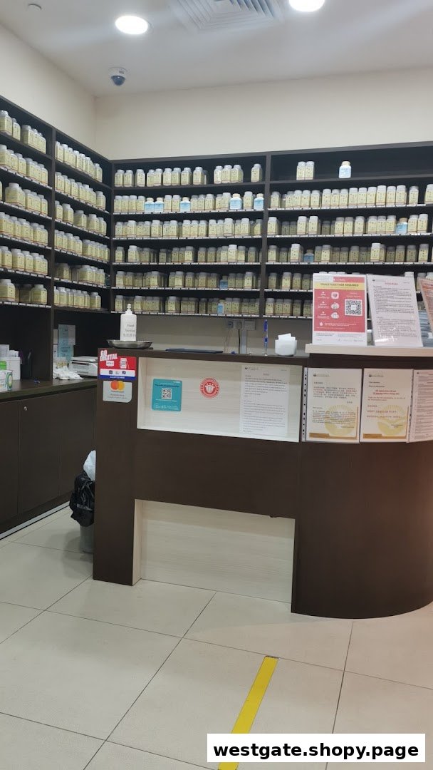 Interior view of Ma Kuang TCM Clinic, featuring a reception counter and shelves stocked with traditional medicine bottles.