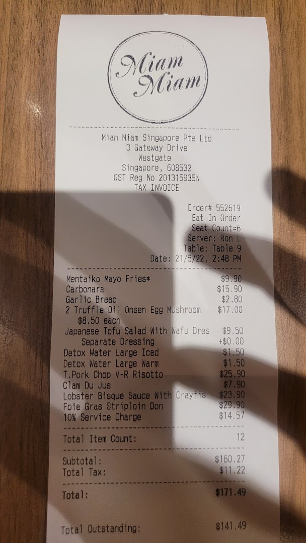 A detailed tax invoice from Miam Miam French Japanese Cafe Kitchen, listing various food and drink items with prices.