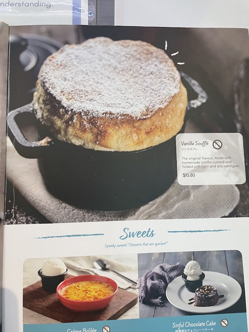 A menu page showcasing delicious dessert options, including soufflé, crème brûlée, and chocolate cake.