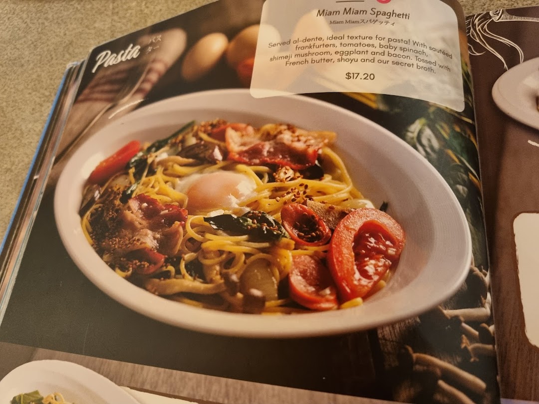 A close-up of the Miam Miam Spaghetti dish and its description from the restaurant's menu.