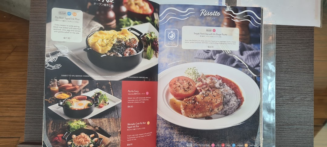 A detailed view of Miam Miam's menu, showcasing French-Japanese fusion rice and risotto dishes.