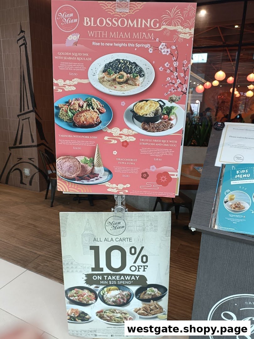 A promotional stand outside Miam Miam French Japanese Cafe Kitchen, showcasing spring specials and a takeaway discount.
