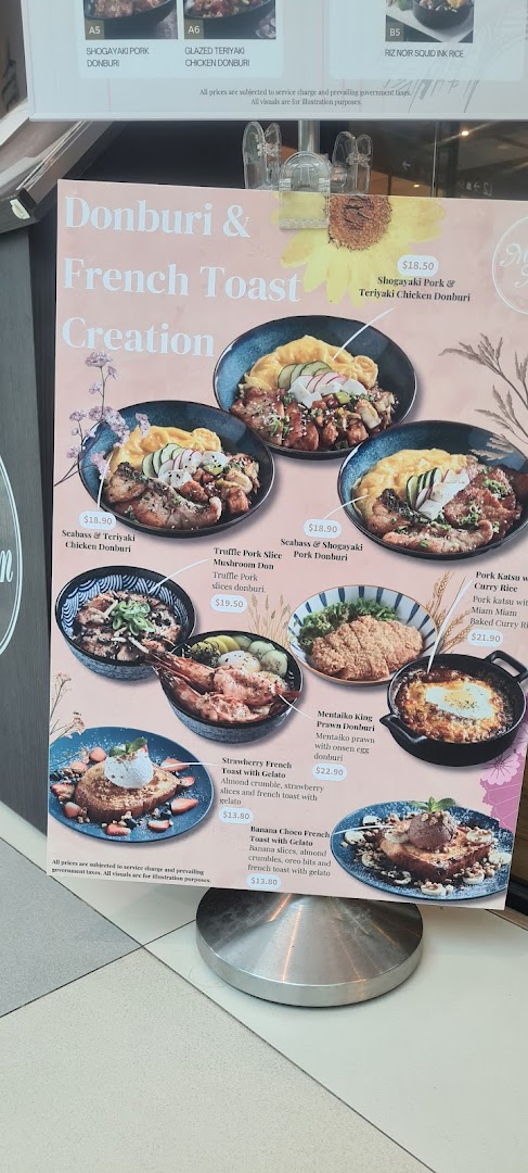 A vibrant menu board showcasing Miam Miam's Donburi and French Toast creations with appealing food photography.