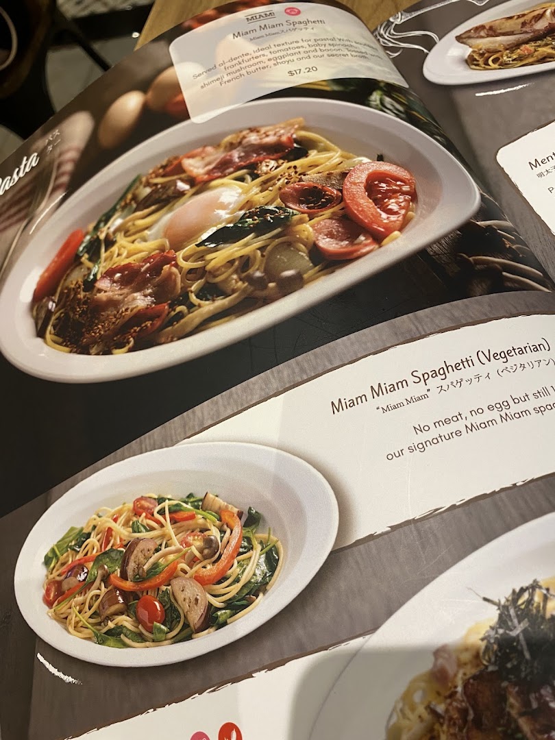 A close-up of a menu page showcasing Miam Miam's signature spaghetti dishes.
