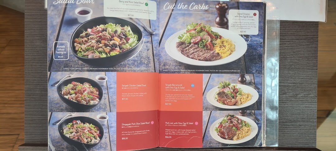 A vibrant menu page showcasing healthy salad bowls and low-carb protein dishes with appealing food photography.