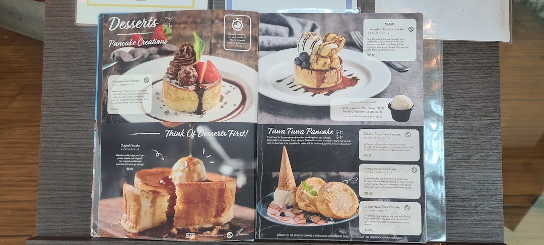 A vibrant menu showcasing various delectable pancake desserts from Miam Miam.