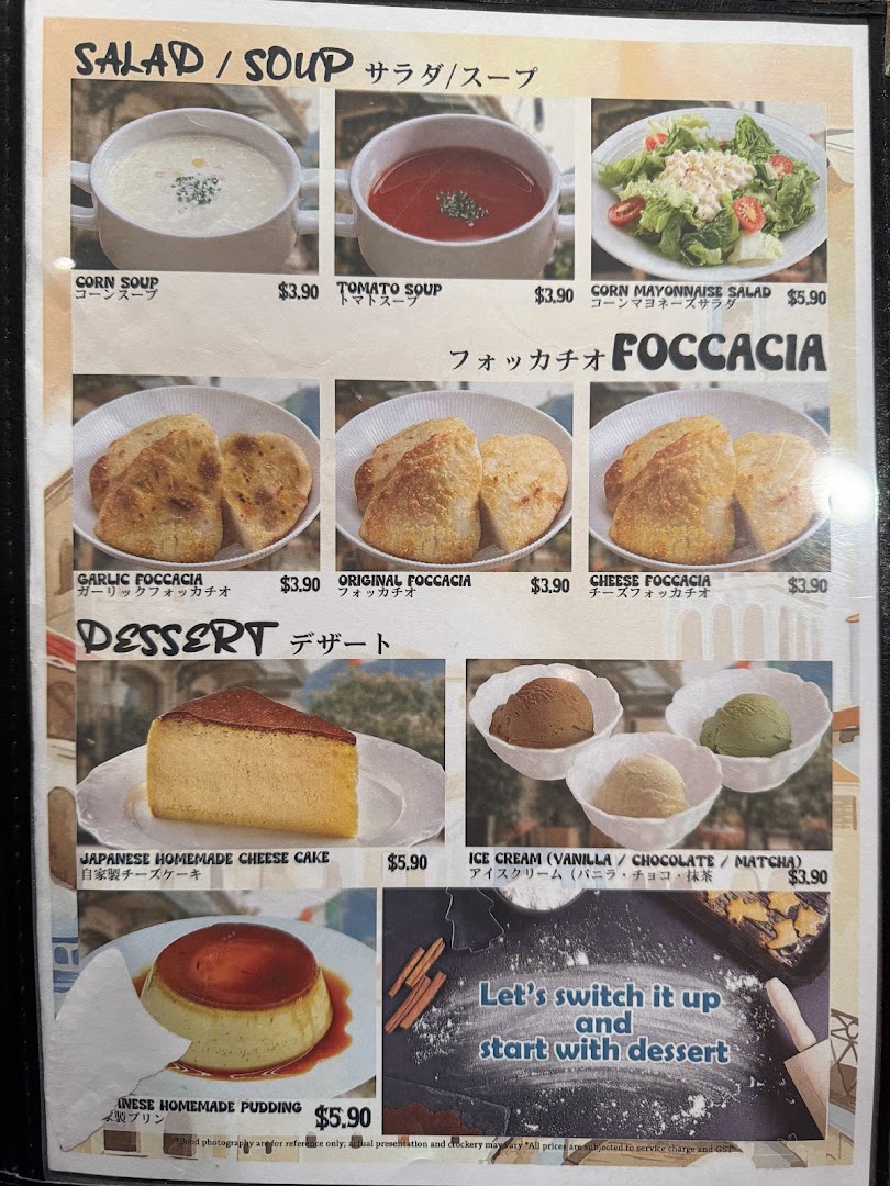 A menu displaying various salads, soups, focaccia, and desserts with prices from Milan Shokudo.