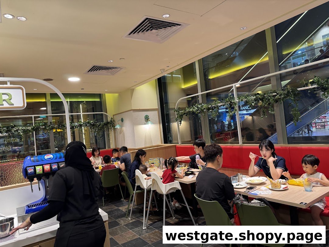 Diners enjoying meals in a brightly lit, spacious restaurant interior with large windows.