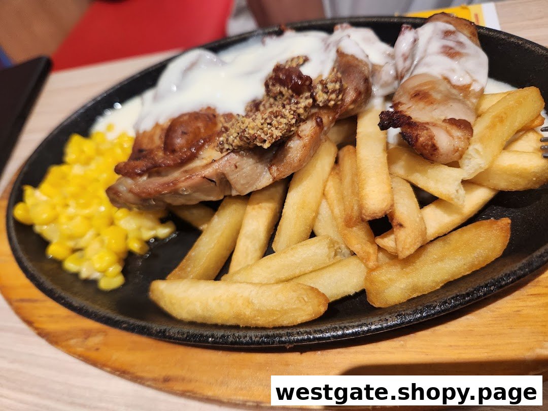A sizzling plate featuring grilled chicken with sauce, golden fries, and sweet corn.