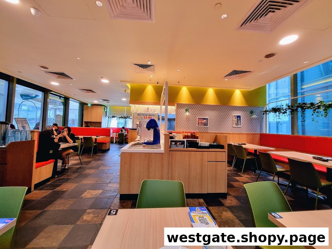 A bright and spacious interior of Milan Shokudo with comfortable seating and a self-service drink station.