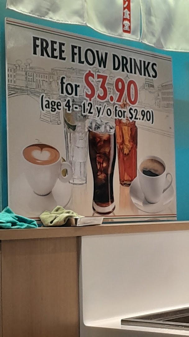 A sign advertising free-flow drinks for $3.90, with a children's price of $2.90.