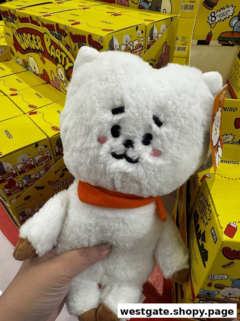 A hand holds a white fluffy BT21 RJ plush toy in MINISO, surrounded by yellow 'Burger Party' themed product boxes.