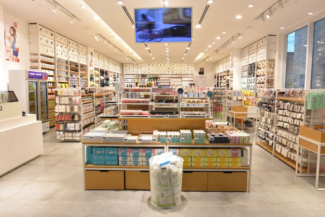 A brightly lit MINISO store interior showcasing a wide array of lifestyle products, cosmetics, and accessories.