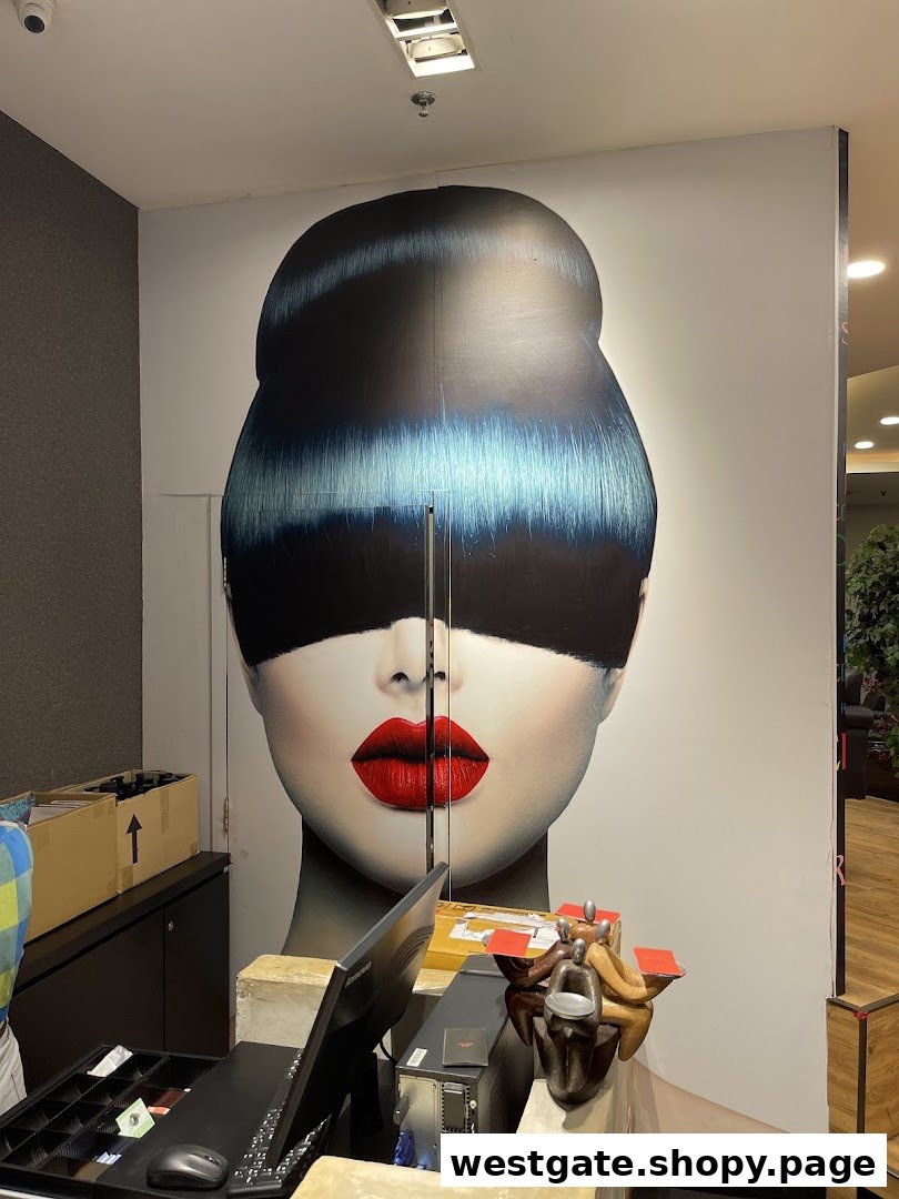 An interior view of Mister Minit Westgate featuring a service counter, computer, and a large graphic of a woman's face.