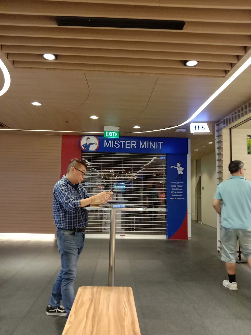 The shop front of Mister Minit Westgate, featuring its signage and a closed security shutter.