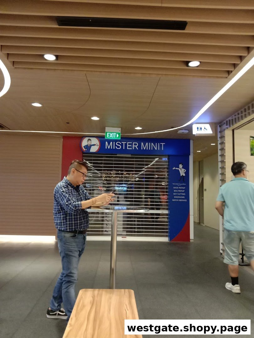 The shop front of Mister Minit Westgate, featuring its signage and a closed security shutter.