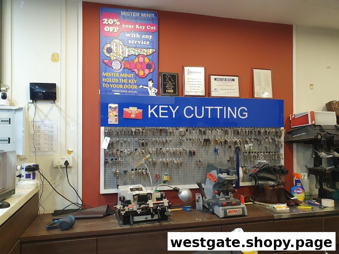 Interior view of Mister Minit's key cutting station, showing machines, a key display, and promotional signage.