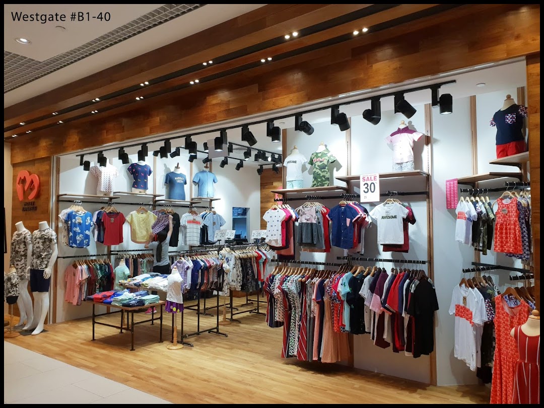 Interior view of Moley Apparels, showcasing a wide range of trendy clothing on racks and mannequins.
