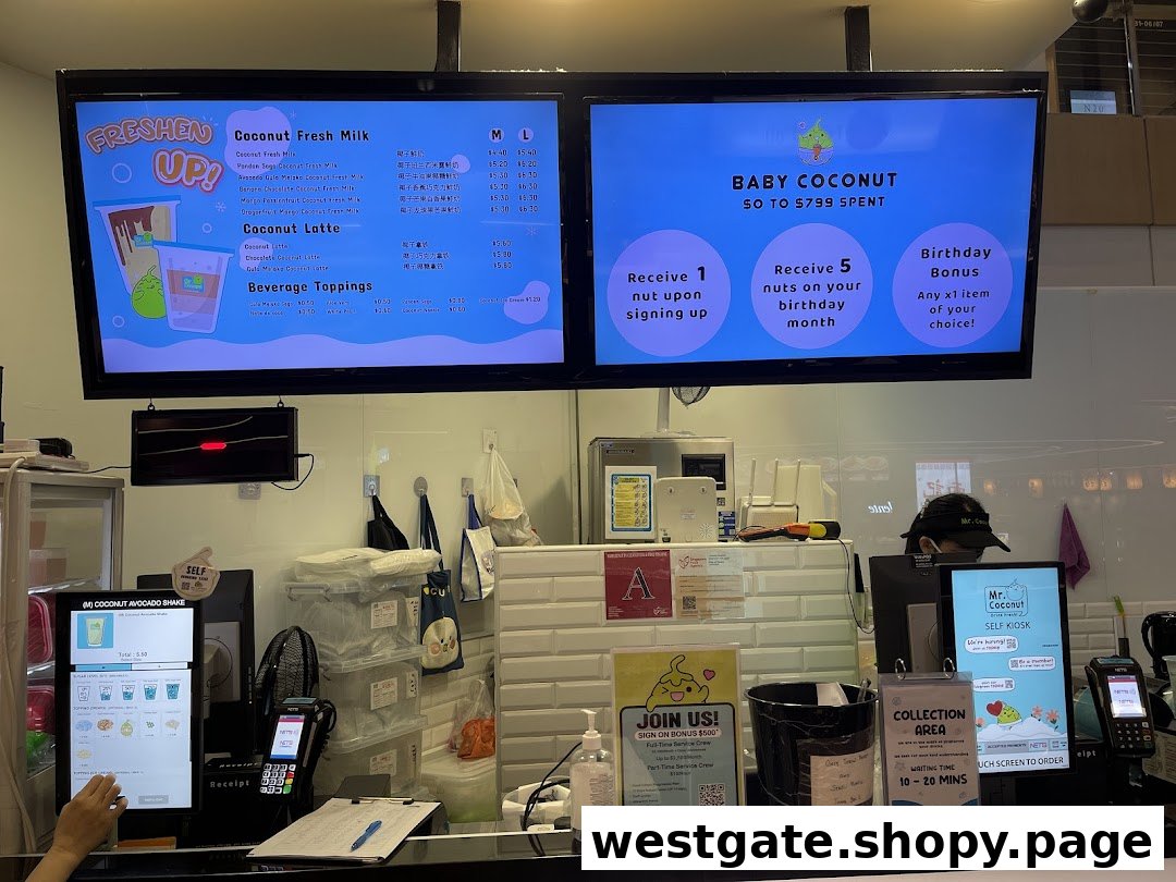 Digital menu boards and a self-service kiosk display coconut-based drinks and loyalty program details at Mr. Coconut.