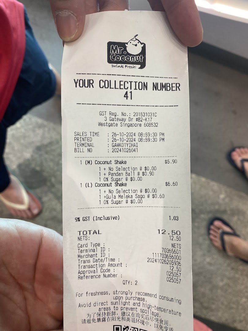 A close-up of a Mr. Coconut receipt showing purchased items and prices.