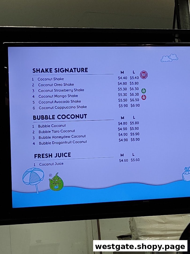 A digital menu board displaying various coconut-based shakes, bubble coconut drinks, and fresh juices.