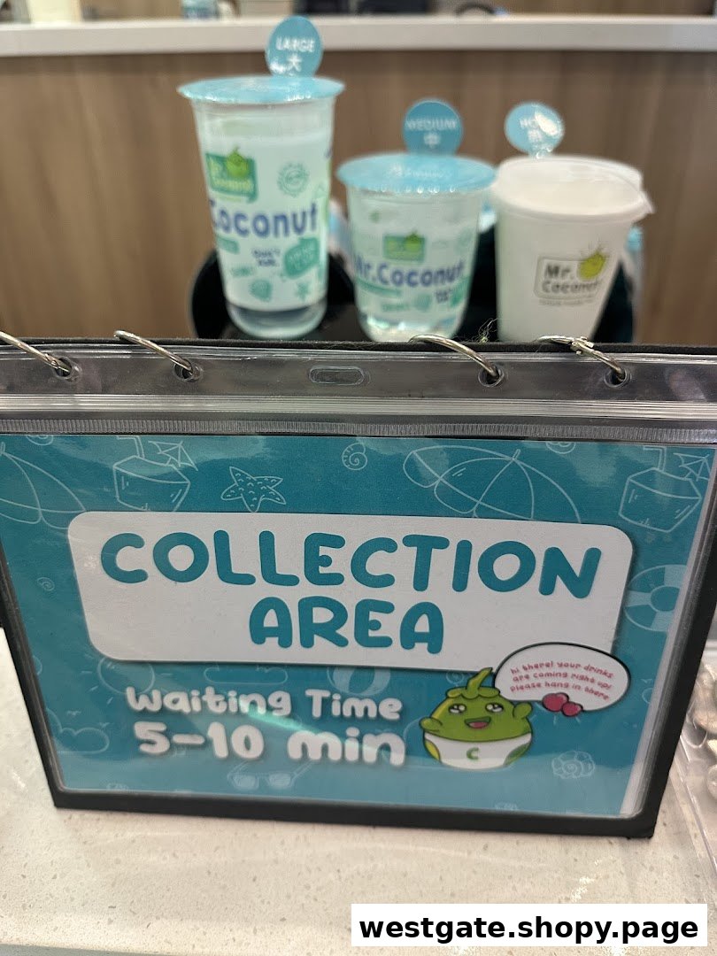 A Mr. Coconut collection area sign with various drink cups and a waiting time display.