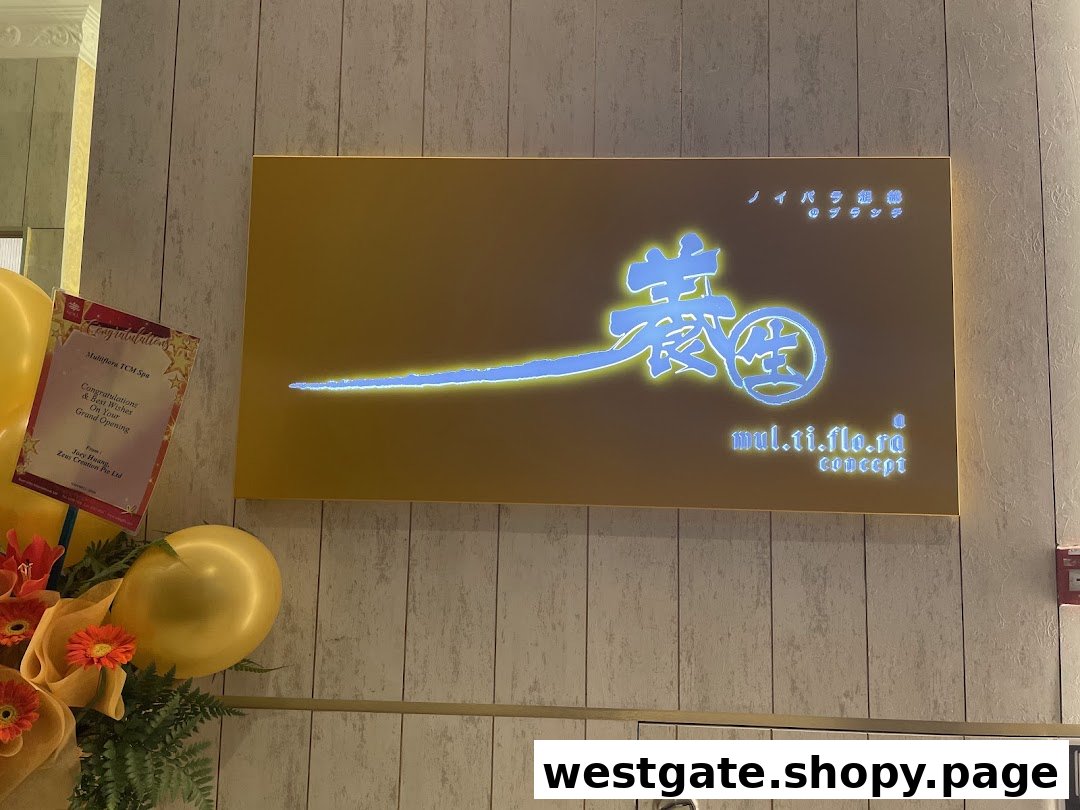 Illuminated Multiflora TCM Spa sign with grand opening decorations.