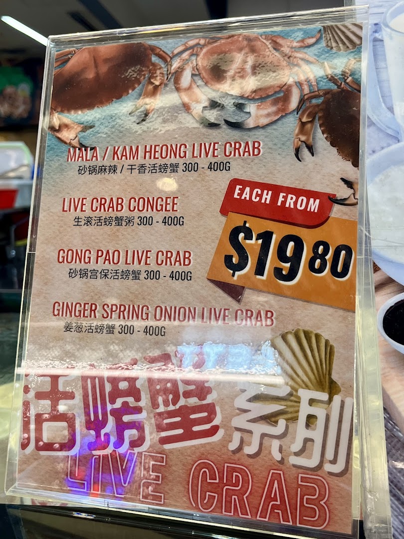 A menu board showcasing various live crab dishes with prices starting from $19.80.