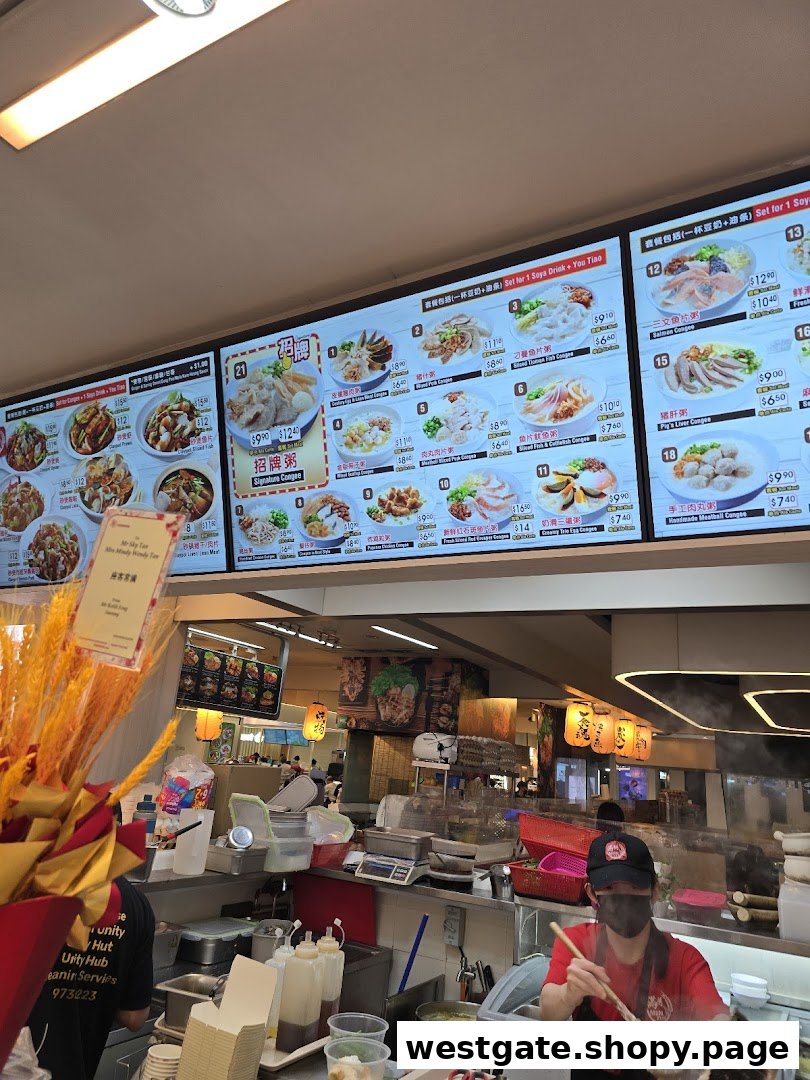 Digital menu boards displaying various congee dishes and prices, with a kitchen area in the foreground.