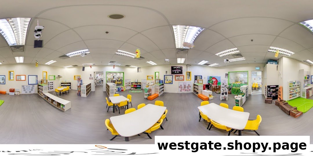 A bright, spacious interior of My First Skool, featuring colorful learning stations, tables, and chairs for young children.