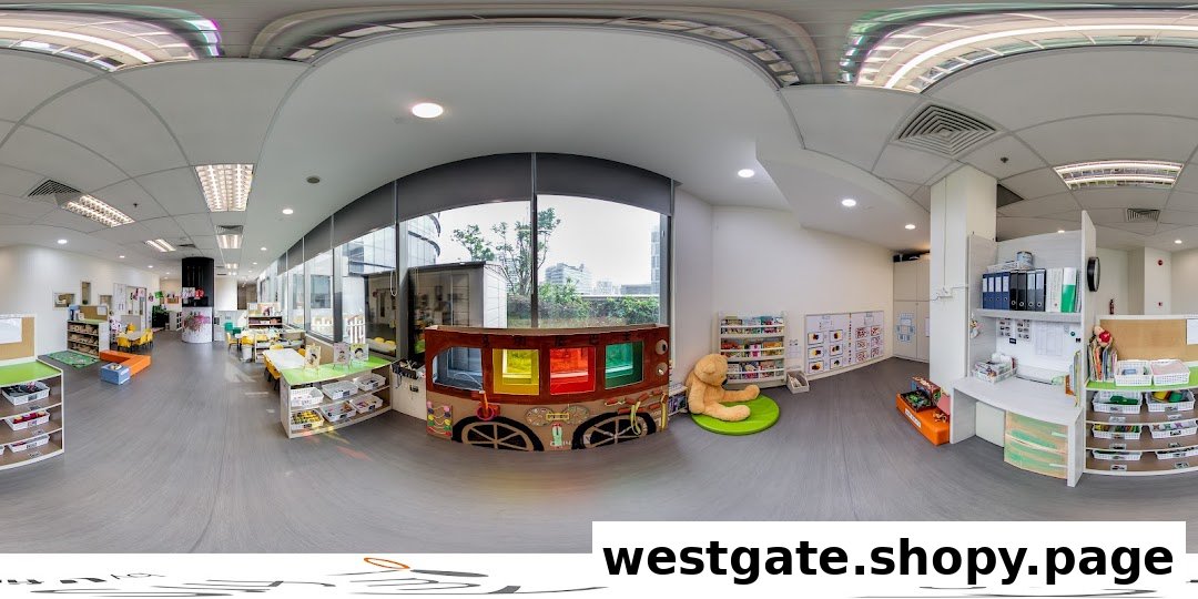 A bright, spacious interior of a childcare center with various learning and play areas for children.
