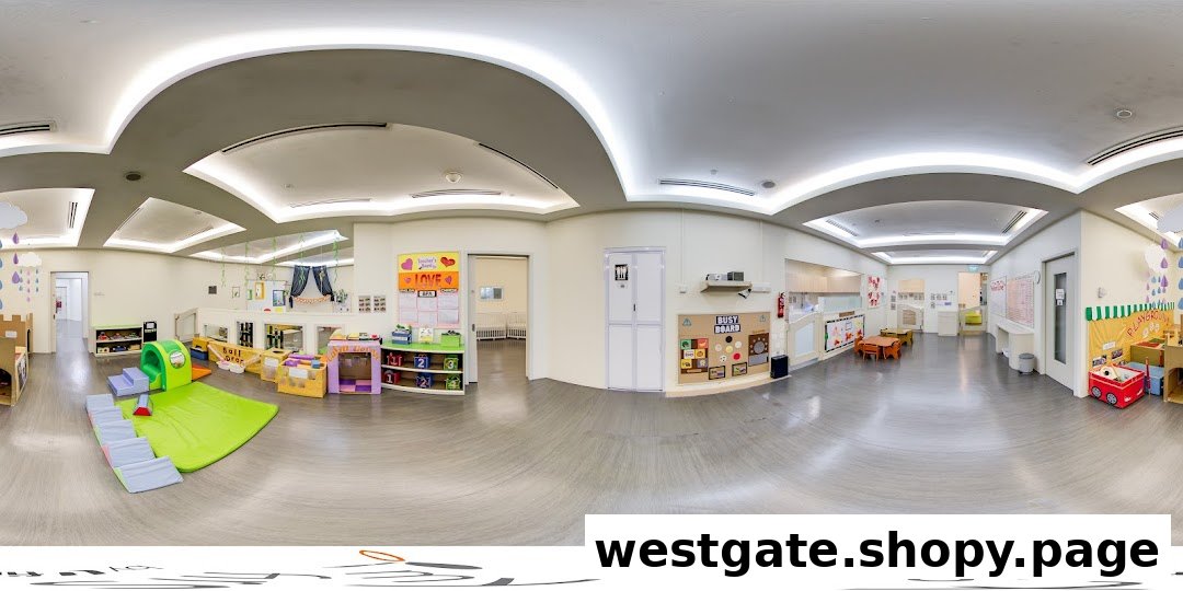 A panoramic view of a bright, spacious childcare classroom with various play and learning zones.