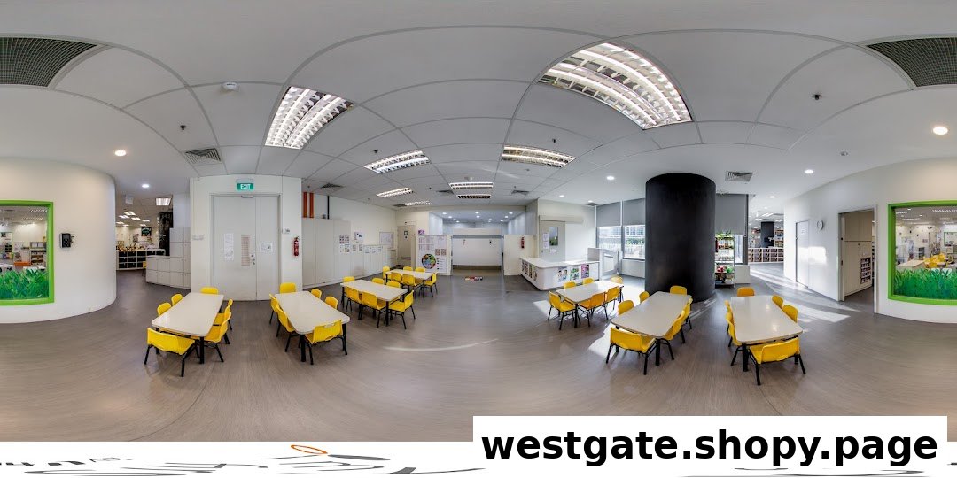 A bright, spacious classroom or activity area with multiple tables and yellow chairs, designed for children's learning and play.